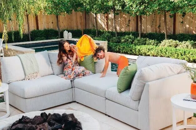 kids playing on an outdoor couch kids playing on an outdoor couch